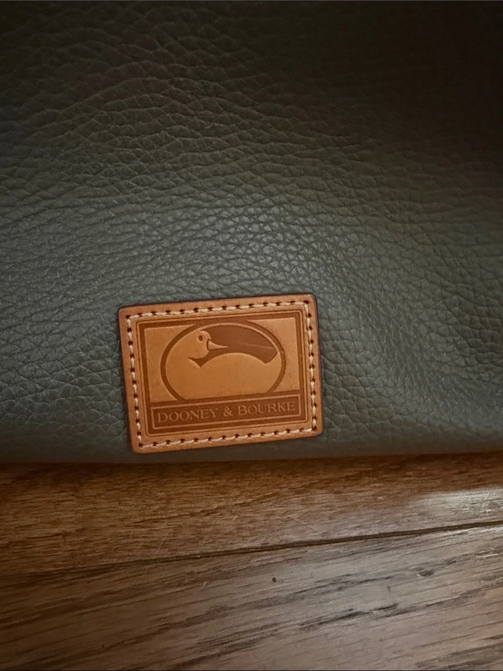 Dooney & Bourke Tote with Tan Leather Straps and Grommet Details